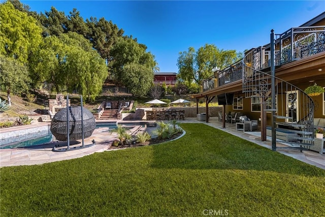 view of yard with a patio area and a swimming pool side deck