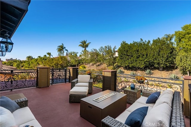 view of patio / terrace with an outdoor living space with a fire pit