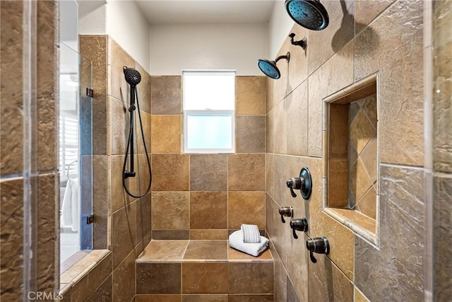 bathroom with a tile shower