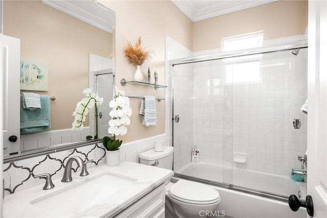 full bathroom featuring toilet, backsplash, ornamental molding, vanity, and shower / bath combination with glass door