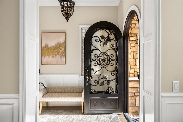 interior space with crown molding and hardwood / wood-style flooring