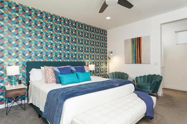 bedroom featuring ceiling fan and dark carpet