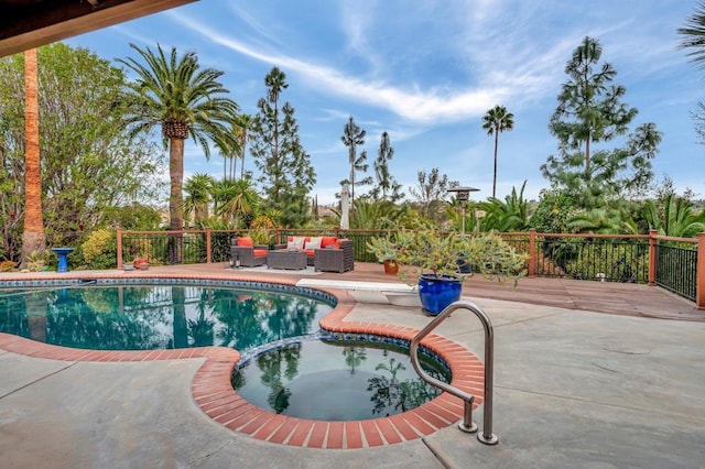 view of pool featuring an outdoor hangout area, a patio, and an in ground hot tub