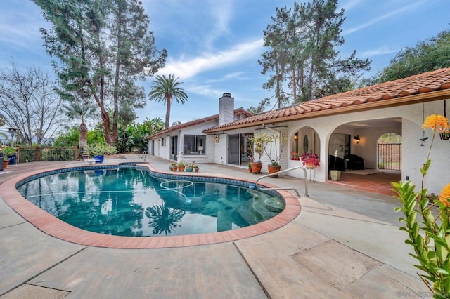 view of swimming pool featuring a patio area