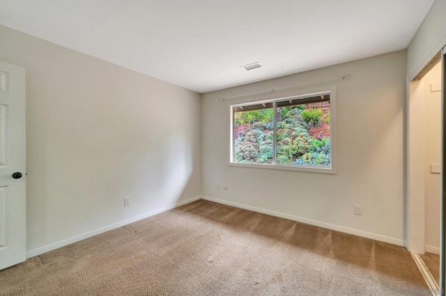 view of carpeted spare room