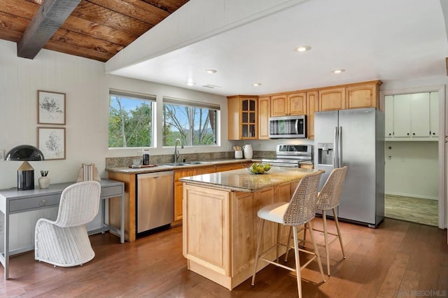 kitchen with a center island, wood-type flooring, sink, stainless steel appliances, and wooden ceiling