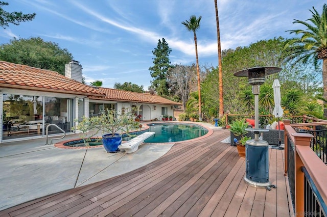 wooden terrace featuring a patio