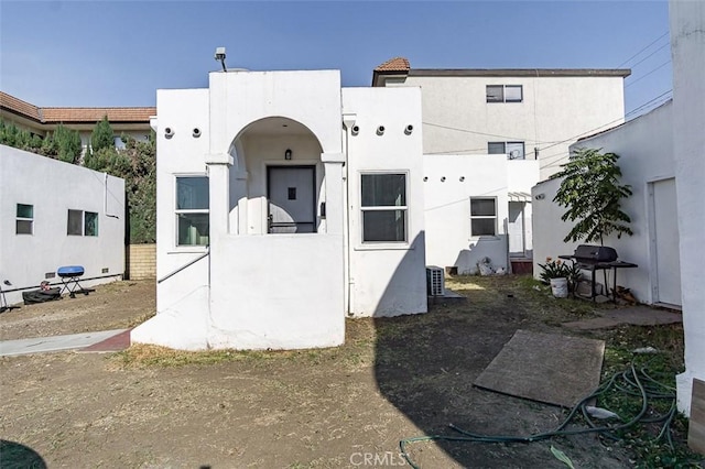 back of property with stucco siding