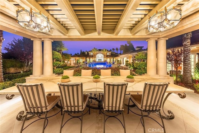 view of patio terrace at dusk