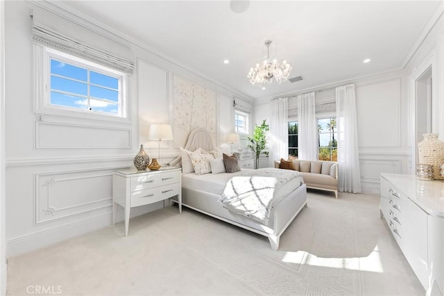 carpeted bedroom featuring a notable chandelier and crown molding