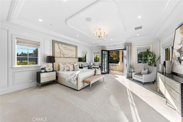 bedroom with french doors, an inviting chandelier, access to exterior, ornamental molding, and a raised ceiling