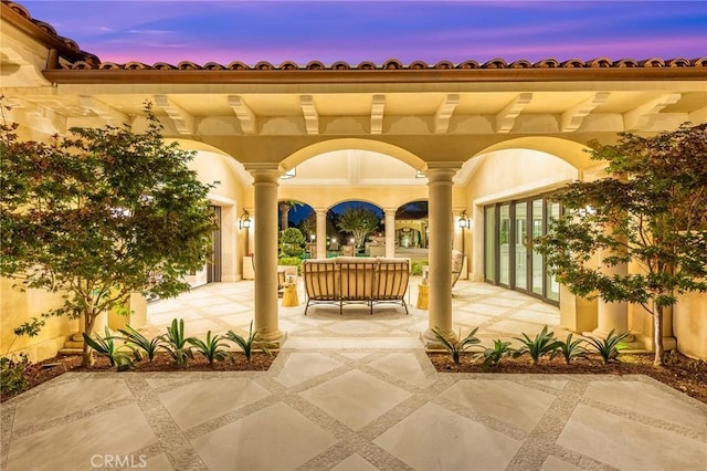 view of patio terrace at dusk