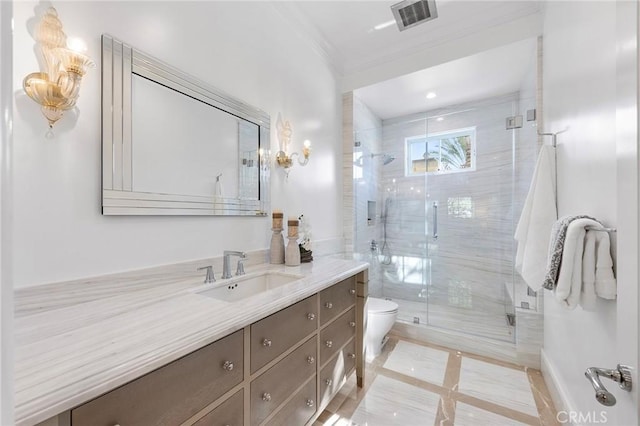 bathroom featuring toilet, a shower with door, and vanity