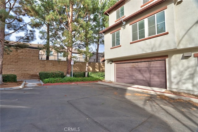 view of side of home with a garage