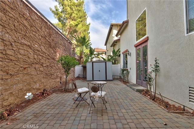 view of patio / terrace featuring a storage unit