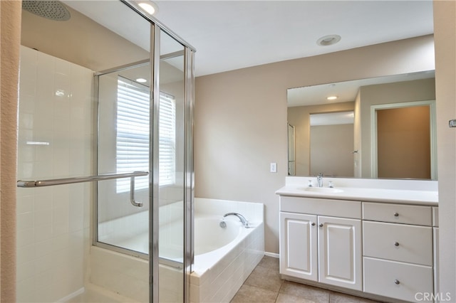 bathroom featuring vanity, tile patterned flooring, and independent shower and bath