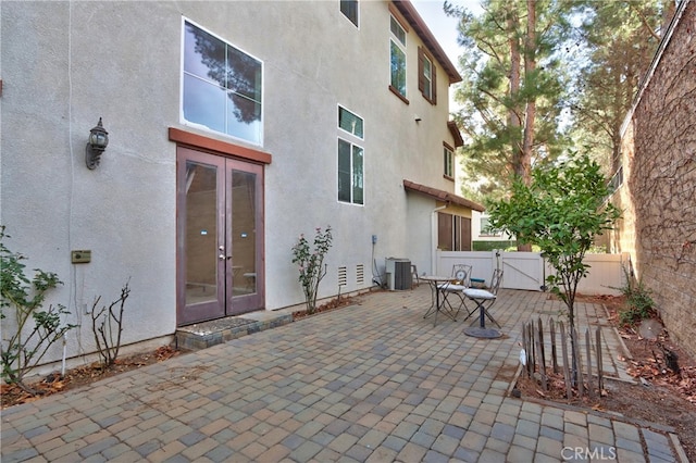 view of patio featuring french doors and central air condition unit