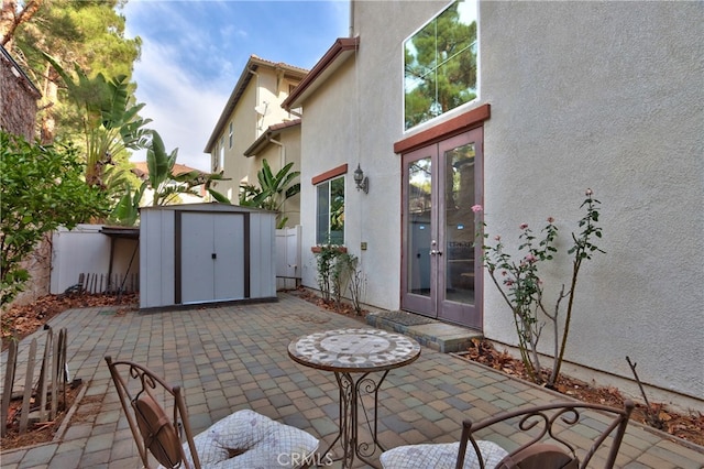 view of patio with a shed and french doors