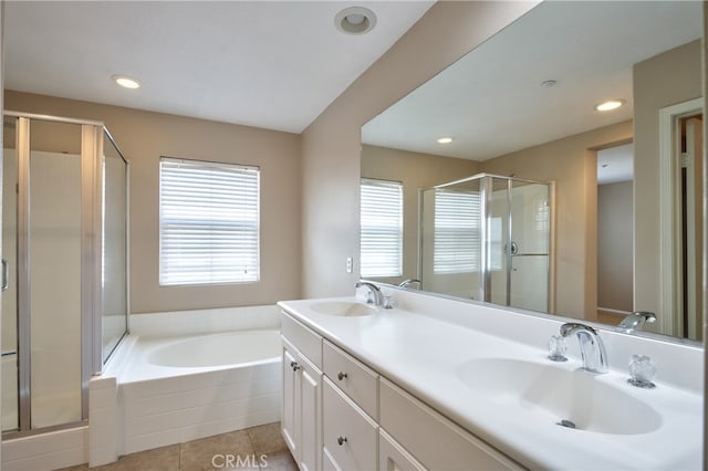 bathroom featuring tile patterned floors, vanity, and separate shower and tub