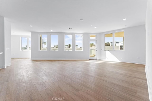 unfurnished living room with light hardwood / wood-style floors