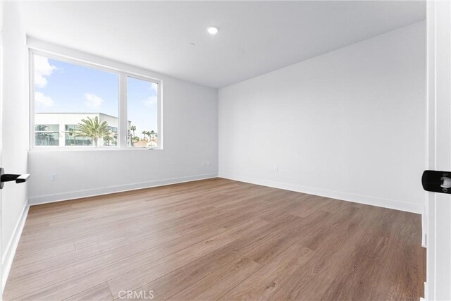 unfurnished room featuring light hardwood / wood-style flooring