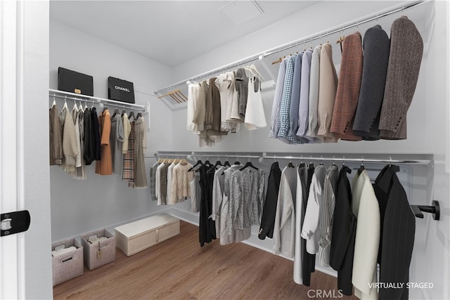 spacious closet featuring hardwood / wood-style flooring