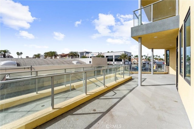 view of patio featuring a balcony