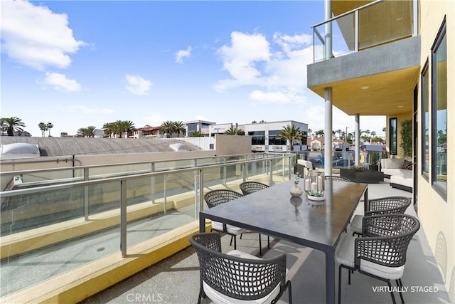 view of patio featuring a balcony