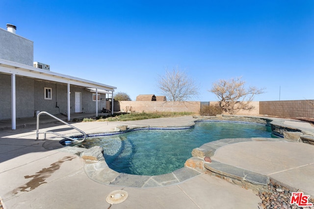 view of swimming pool featuring a patio