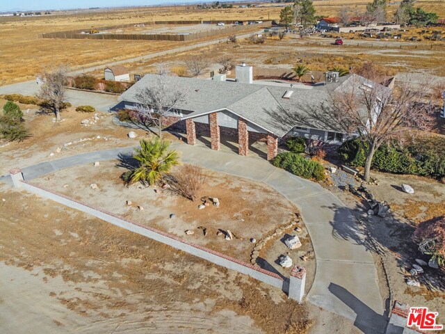 birds eye view of property featuring a rural view