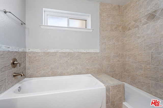 bathroom with a bathing tub