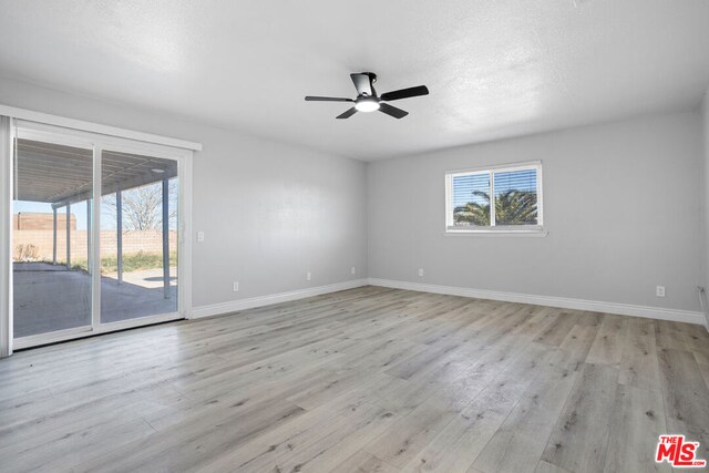 unfurnished room with ceiling fan and light hardwood / wood-style flooring