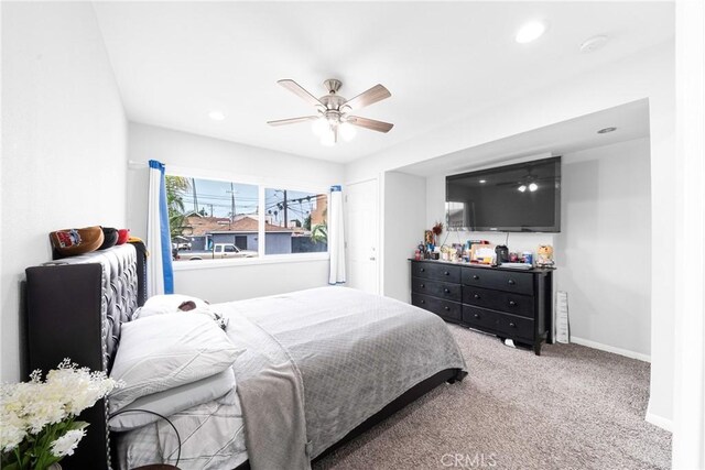 carpeted bedroom featuring ceiling fan