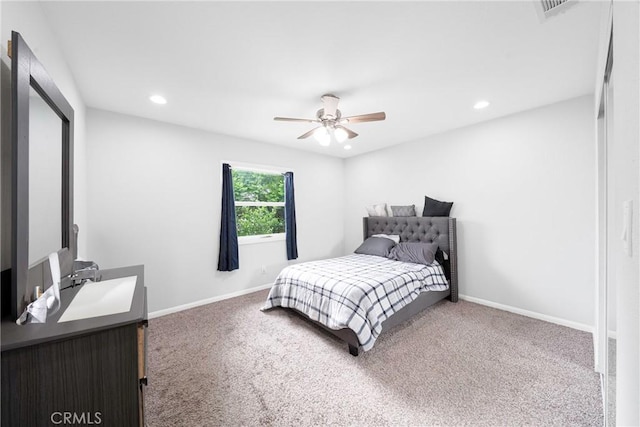 bedroom with ceiling fan and carpet floors