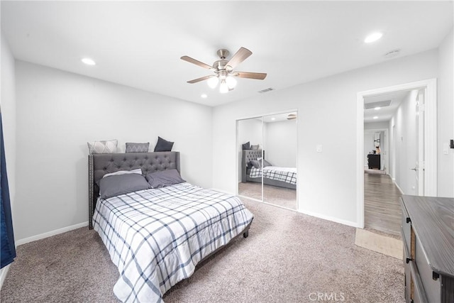 bedroom featuring ceiling fan, a closet, and carpet floors