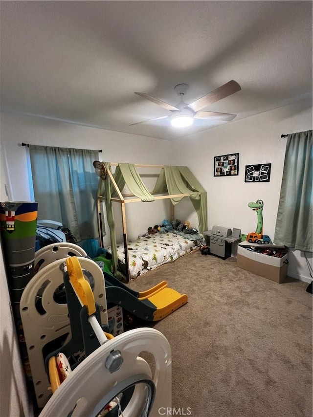 bedroom featuring ceiling fan and carpet flooring