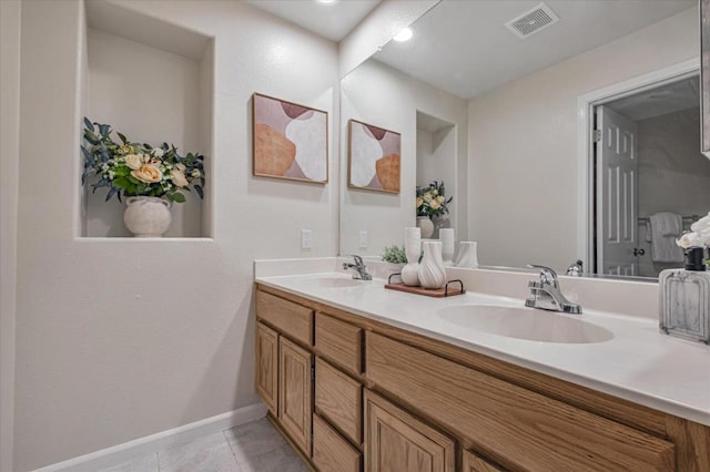 bathroom featuring vanity and tile patterned flooring