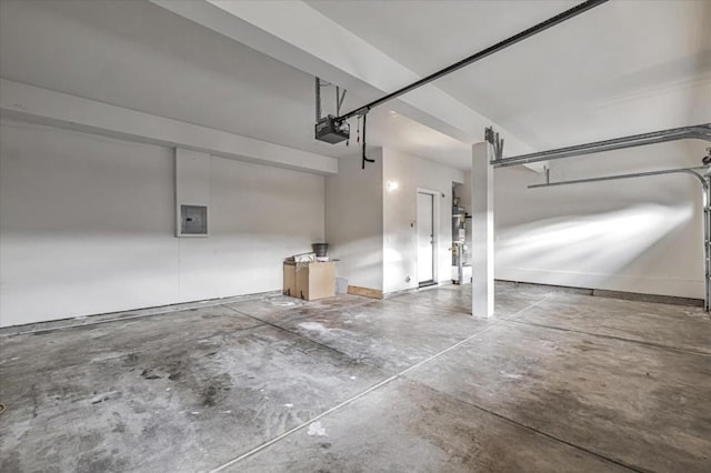 garage featuring a garage door opener and electric panel