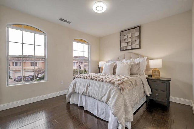 bedroom featuring dark hardwood / wood-style flooring