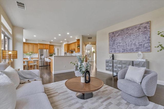 living room featuring dark hardwood / wood-style floors