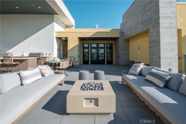 414 Main St Unit 310, Huntington Beach, CA 92647 - view of patio featuring an outdoor living space with a fire pit, french doors, and grilling area