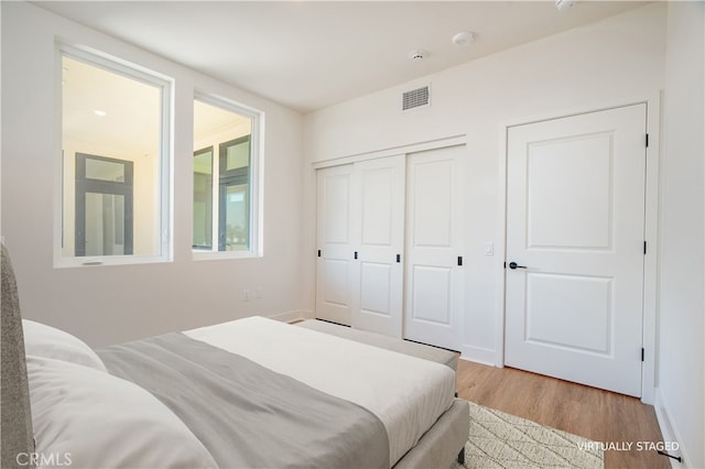 414 Main St Unit 310, Huntington Beach, CA 92647 - bedroom featuring wood finished floors and a closet