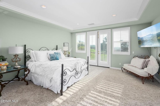 bedroom with crown molding, access to outside, a raised ceiling, and light carpet