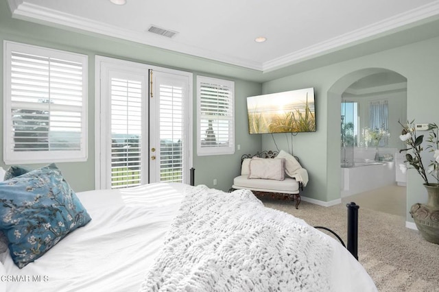 carpeted bedroom with crown molding and access to exterior