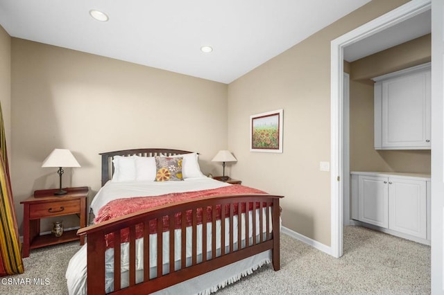 bedroom with light colored carpet