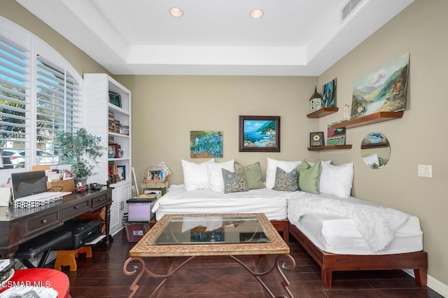 bedroom with a tray ceiling