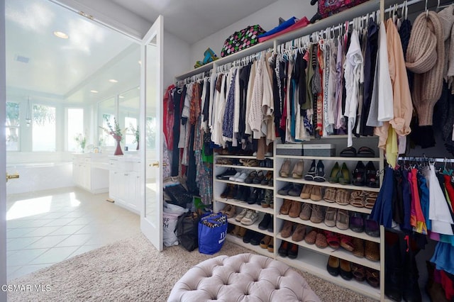 spacious closet with tile patterned flooring