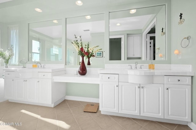 bathroom with tile patterned floors and vanity