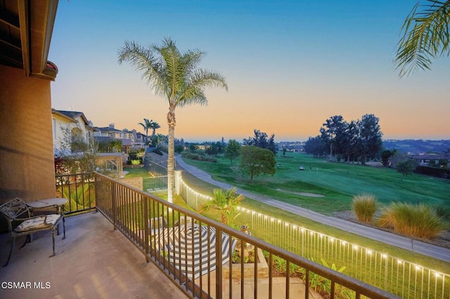 view of balcony at dusk