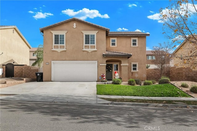 view of front of property with a front yard and a garage